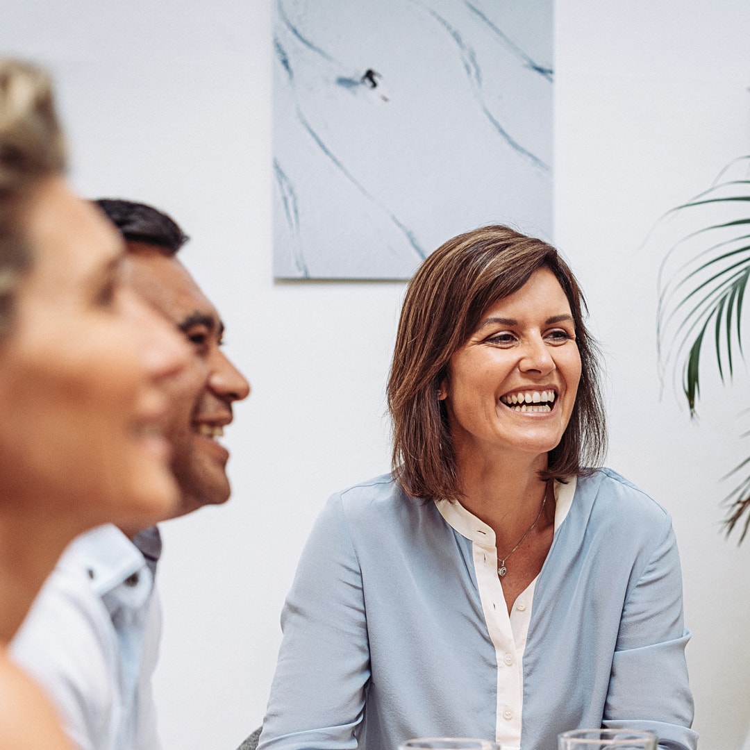 happy office worker smiling in meeting